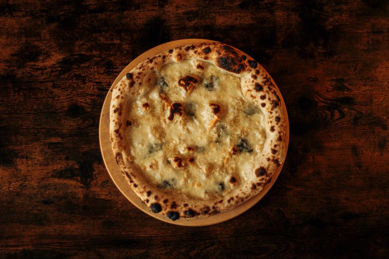 Four Cheese classic pizza with a blend of premium cheeses