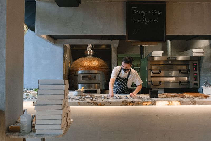 Open kitchen concept at Punch pizza where guests watch pizza being made